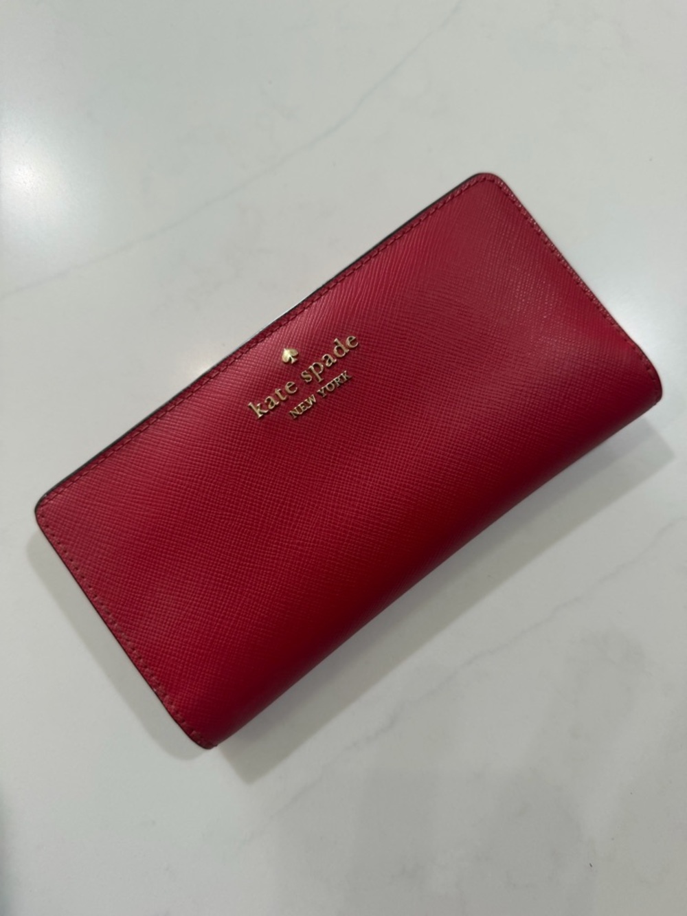 kate spade red saffiano zip-around continental wallet with gold logo